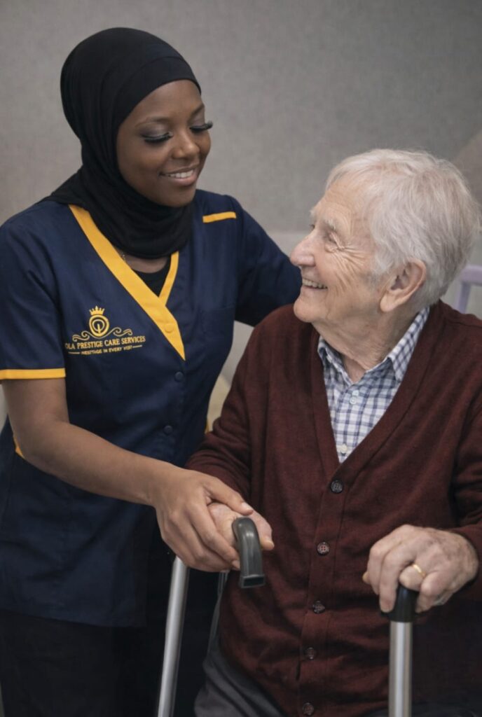 Caregiver assisting elderly person with walker.